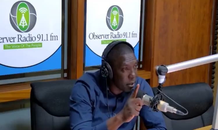 pringle on radio with a raised finger